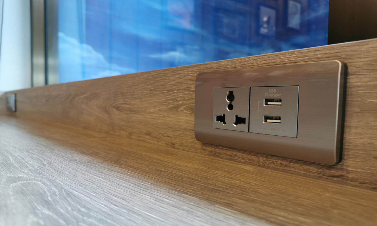 Wall socket with built-in USB ports and single power outlet for charging devices