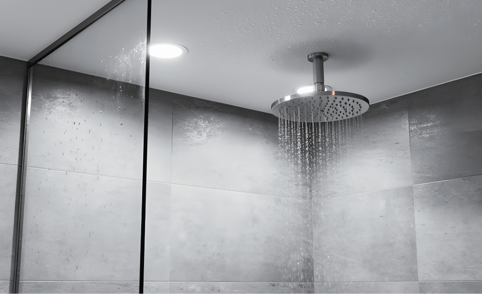 IP65-rated downlight installed directly above a shower in a UK bathroom