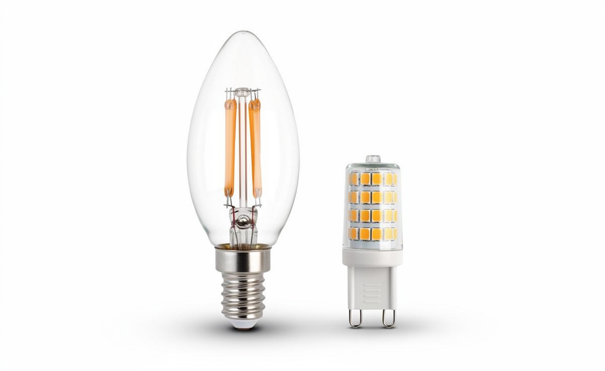 E14 candle filament bulb and G9 LED capsule bulb side by side showing the difference in size and cap fitting.jpg